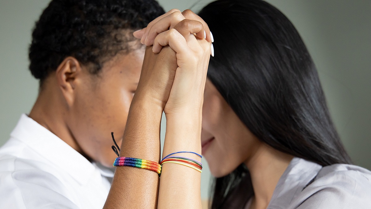 two people tied their hands in front of them